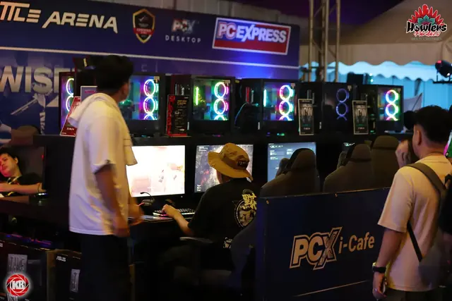 The gaming zone with rows of glowing PCs